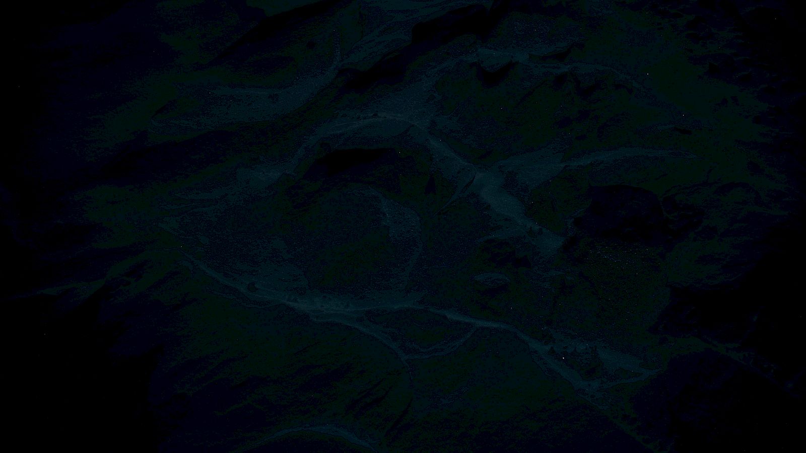 The image is too dark to make out any details clearly, appearing mostly black with indistinct shapes.